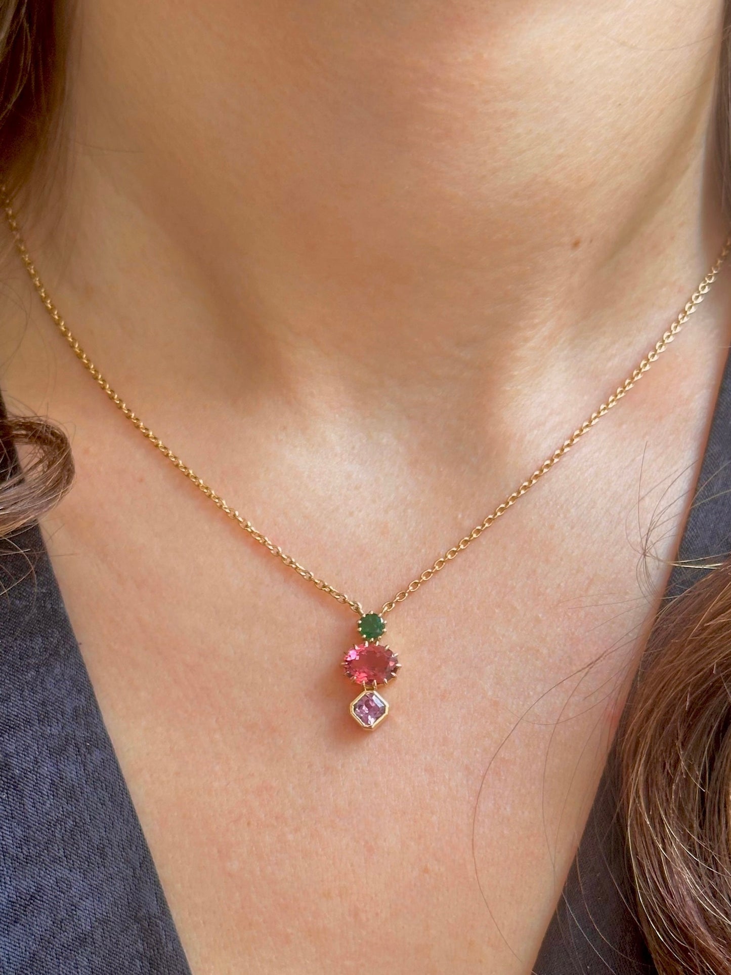 18k gold three Stone Necklace: october birthstone Tourmaline, May Birthstone: emerald, and September Birthstone: sapphire | Ella Creations Jewelry