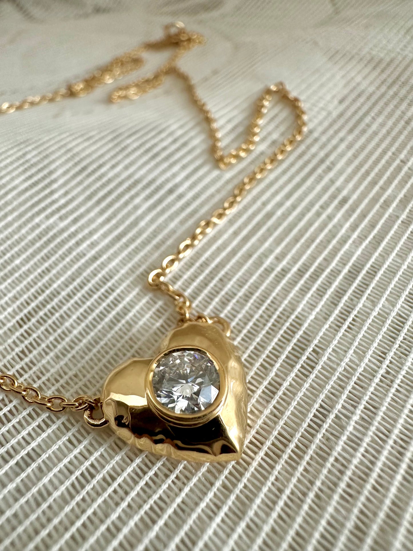 Diamond Heart necklace hand crafted in 18 karat gold with a certified lab created diamond at its center | Ella Creations jewelry