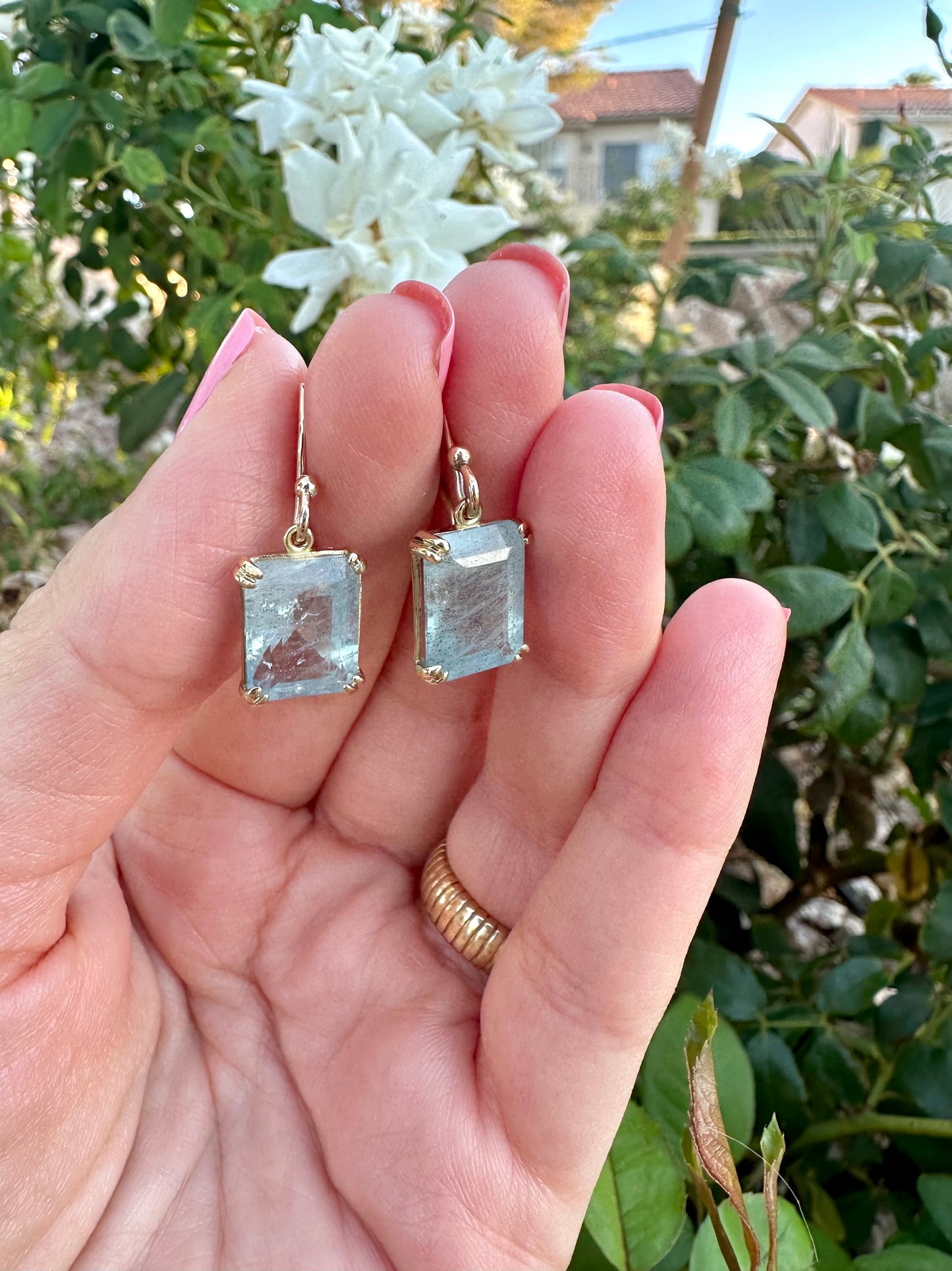 Elegant Drop Aquamarine Earrings handcrafted in 18 karat solid gold featuring emerald cut light green aquamarine stones in an open back prong setting and delicate french hooks. | Ella Creations Jewelry