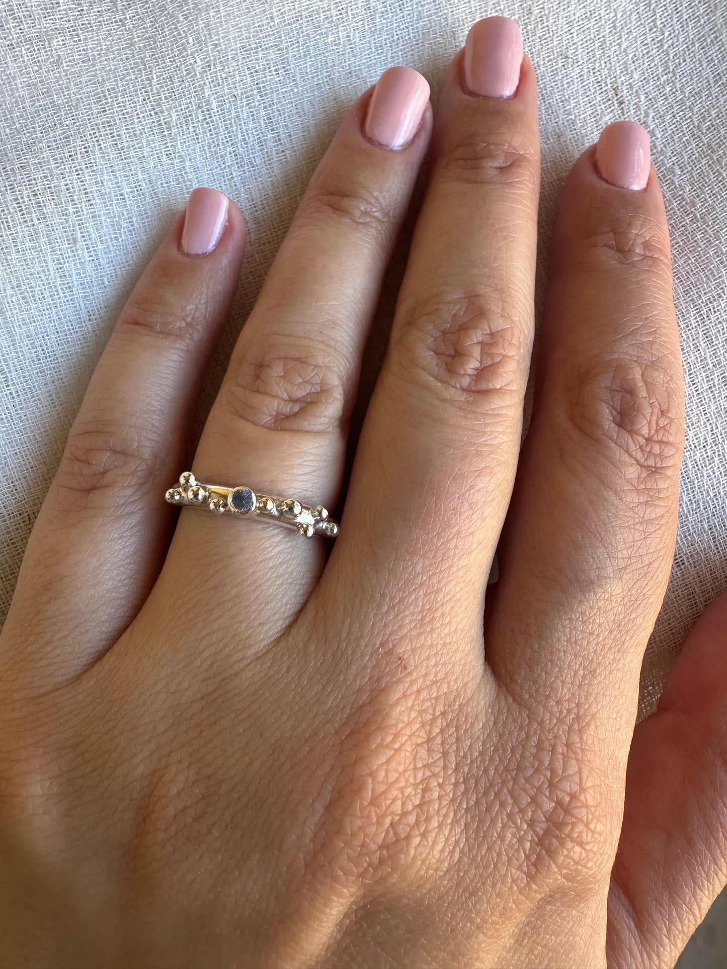 Handcrafted Silver ring with granulations and blue sapphire at its center | Ella Creations Jewelry