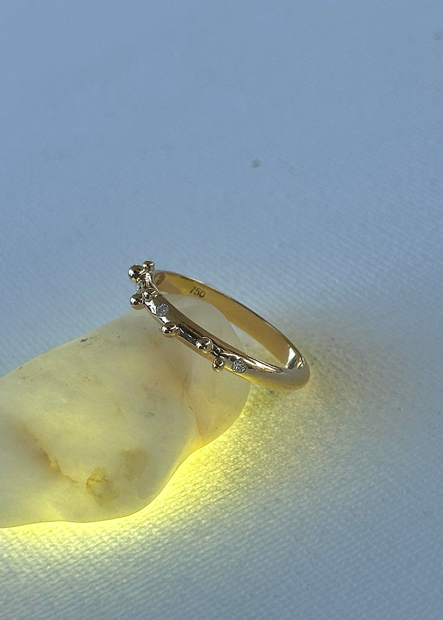 Elegant thin Diamond band, hand-crafted in 18k gold, this thin gold band features a smooth D shape band with gold granulations and 4 flushed diamonds of 1.4mm diameter each placed randomly between the granules | Ella Creations Jewelry