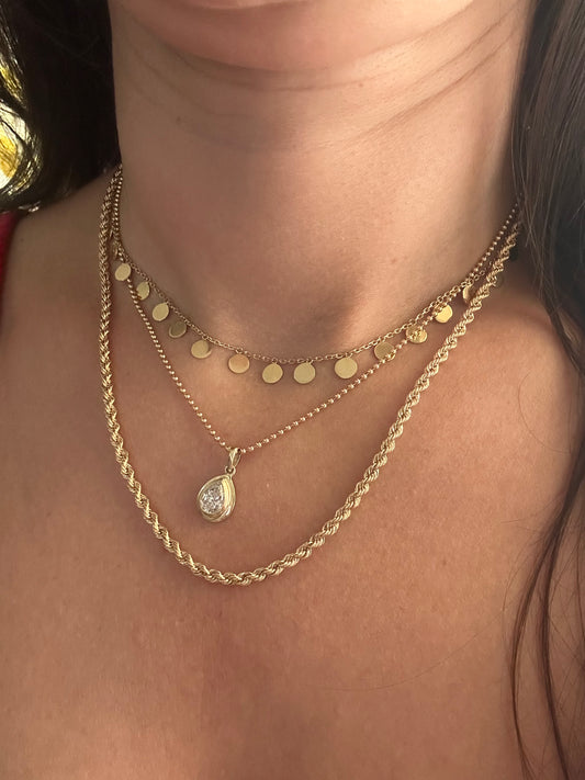 Necklace Stack featuring 18K Gold Disc Necklace, round bead necklace with Diamond Pendant and 18K Rope chain.