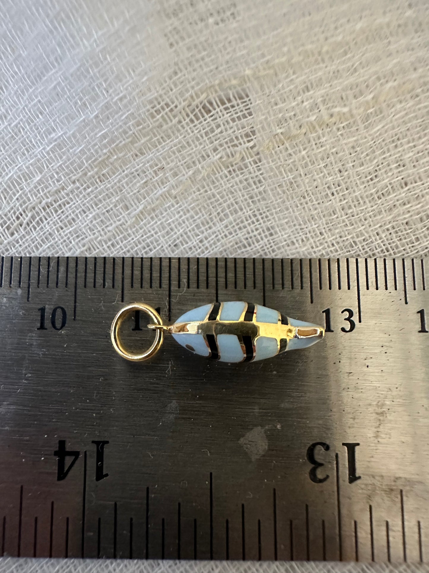 18k Gold Fish Charm, crafted in 18k yellow gold and beautifully accented with vibrant light blue and black enamel | Ella Creations Jewelry