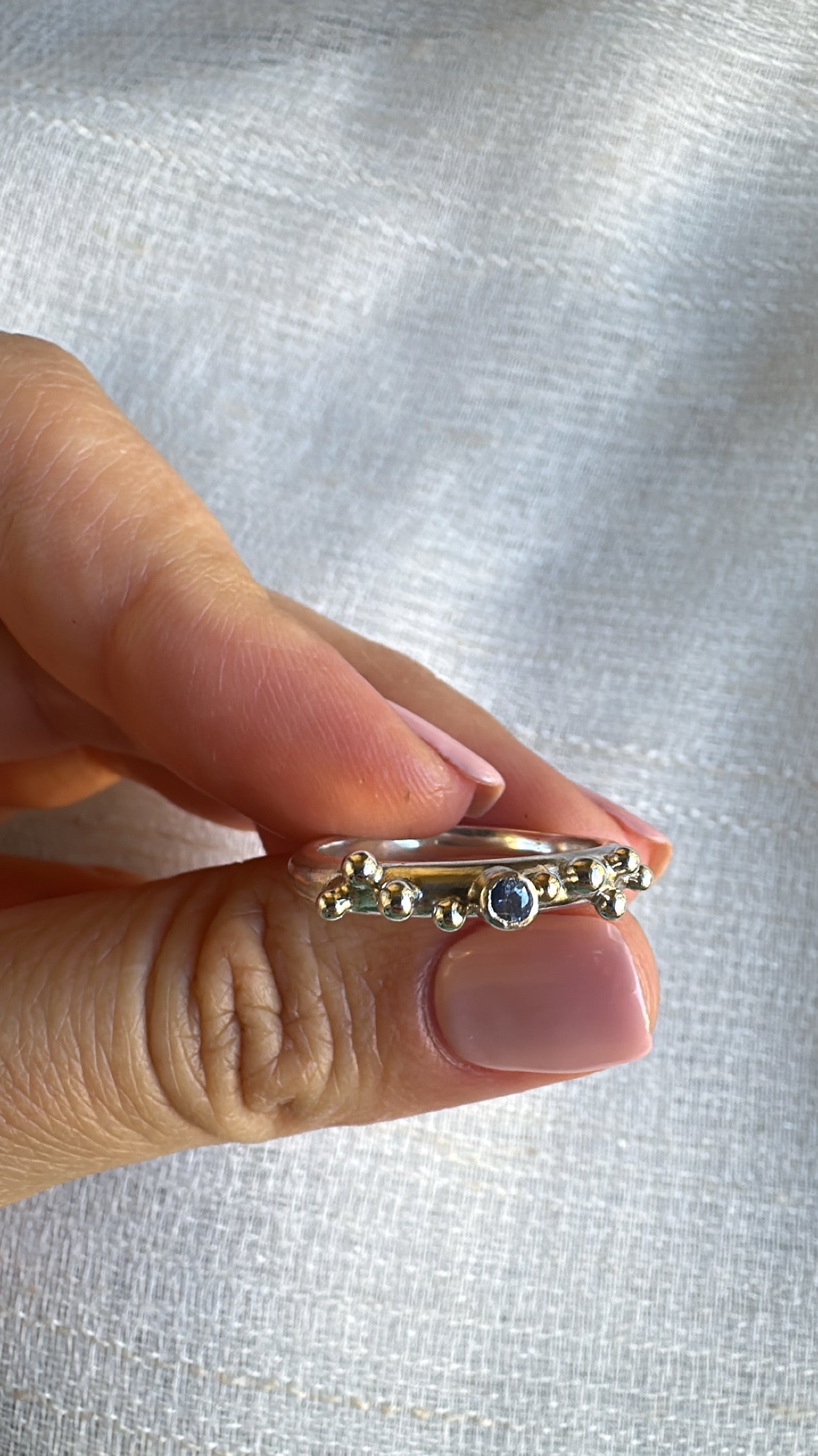 Handcrafted Silver ring with granulations and blue sapphire at its center | Ella Creations Jewelry