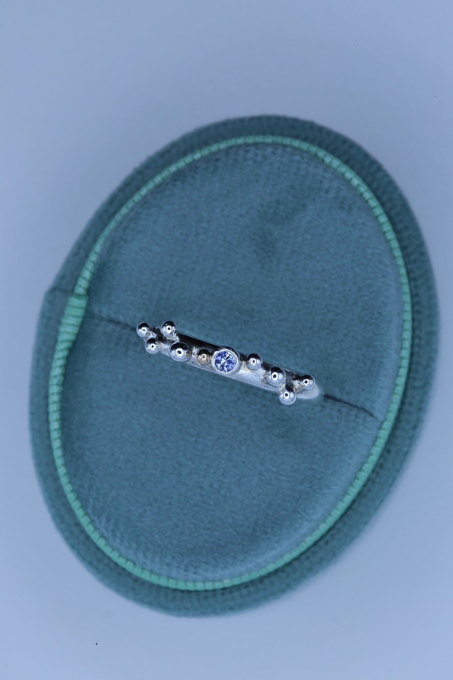 Handcrafted Silver ring with granulations and blue sapphire at its center | Ella Creations Jewelry
