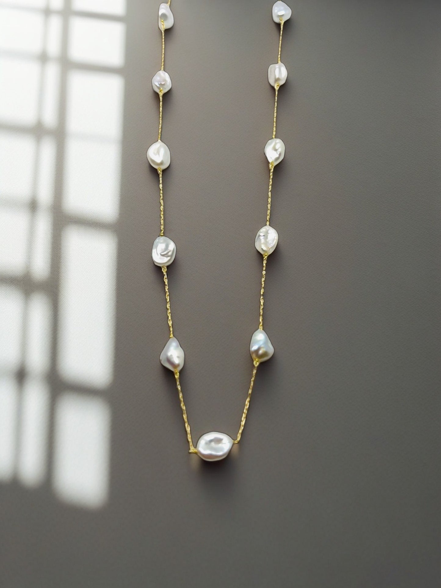 Exquisite Baroque Pearl Necklace, handcrafted in 18k solid gold, this station necklace, features a delicate gold chain adorned with lustrous Baroque Pearls that are uniquely shaped, offering a distinctive look that is both organic and sophisticated. | Ella Creations Jewelry