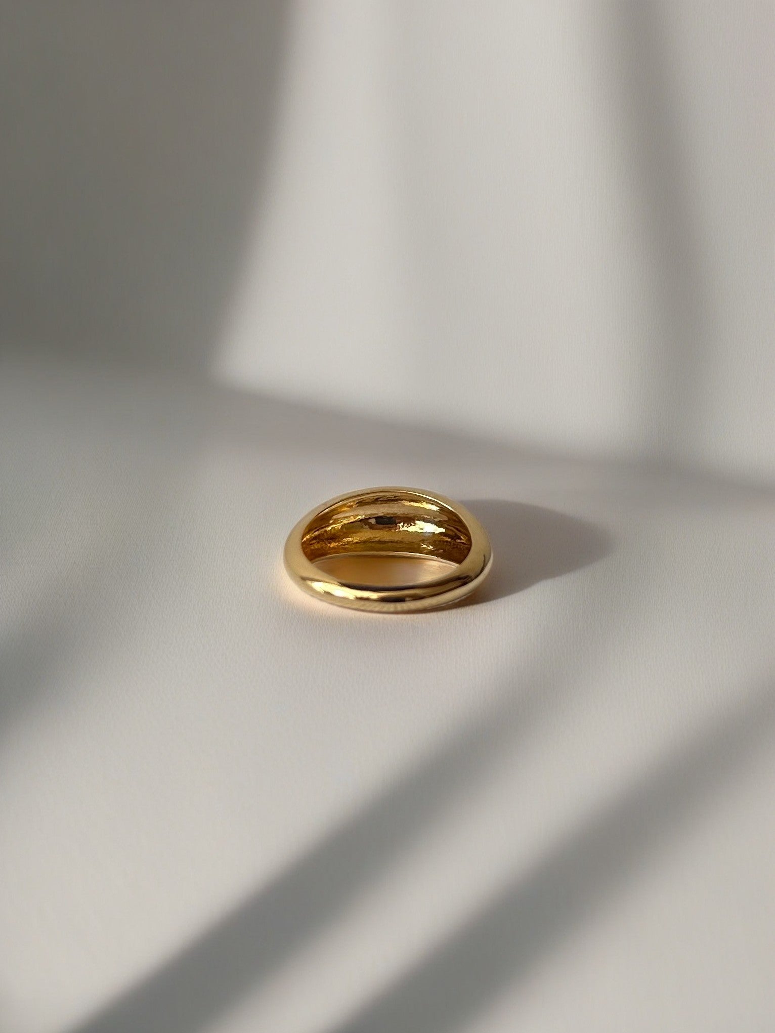 Gold Dome Ring handcrafted in 14k or 18k solid gold, the ring tampers from 7.5mm to 3mm | Ella Creations Jewelry