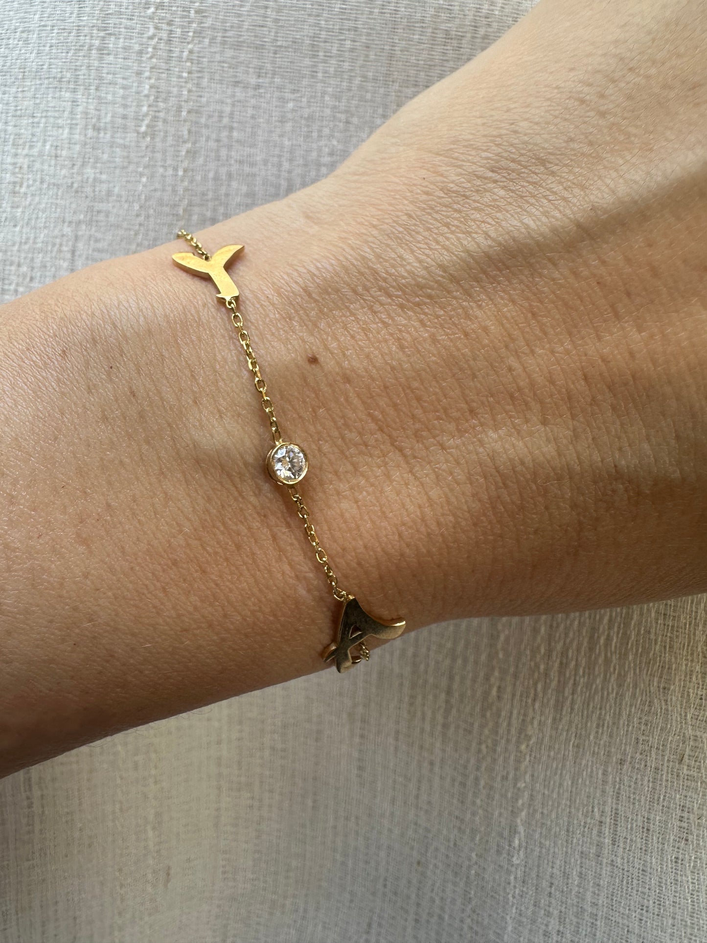 Custom made Initial Bracelet handcrafted in 18 karat gold. You can select to have it in Yellow, White or Rose gold, 1 initial or 2 with an addition of a 3mm lab grown diamond or without. Please mention your initial/s at checkout.