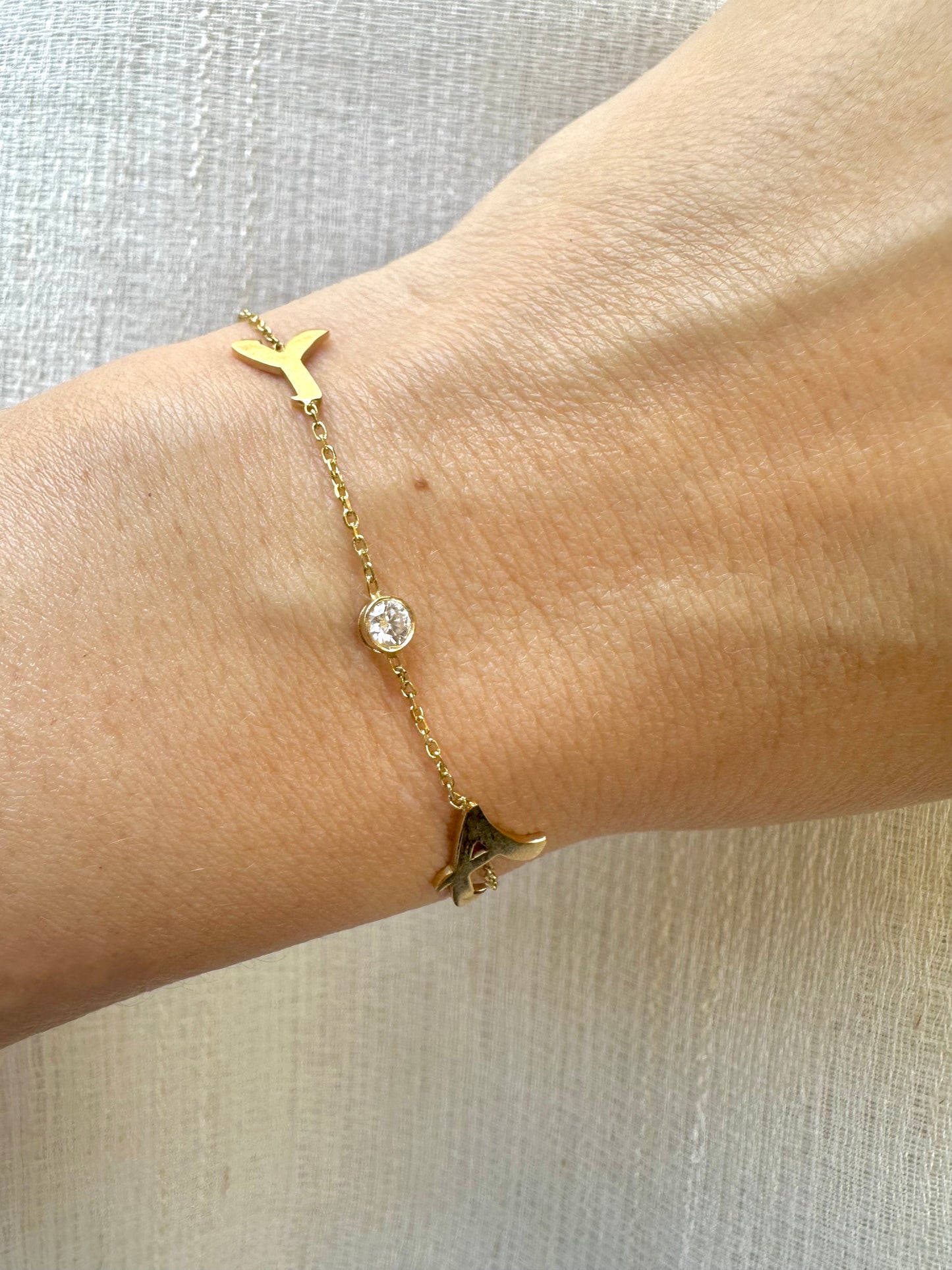 Custom made Initial Bracelet handcrafted in 18 karat gold. You can select to have it in Yellow, White or Rose gold, 1 initial or 2 with an addition of a 3mm lab grown diamond or without. Please mention your initial/s at checkout.