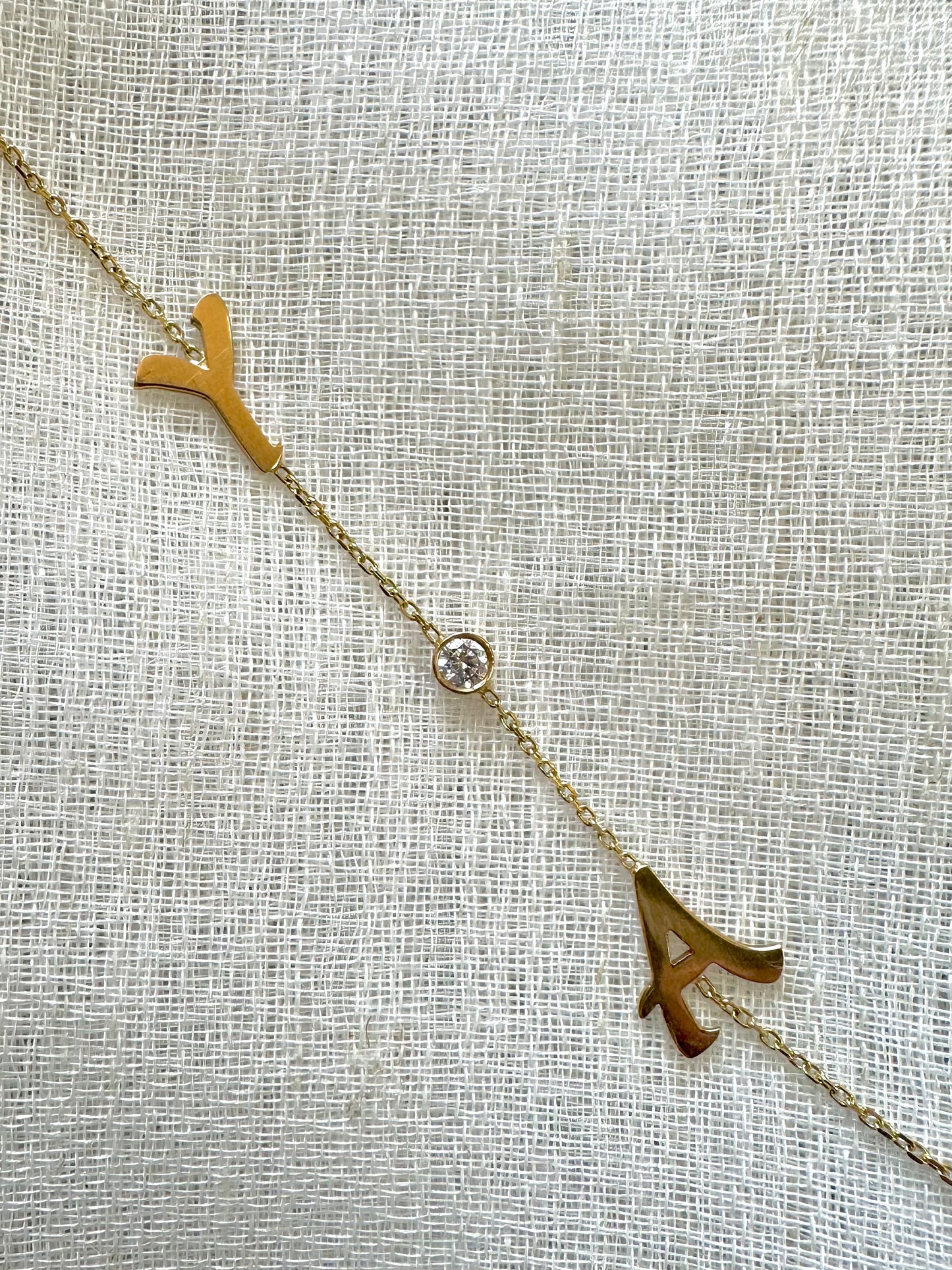 Custom made Initial Bracelet handcrafted in 18 karat gold. You can select to have it in Yellow, White or Rose gold, 1 initial or 2 with an addition of a 3mm lab grown diamond or without. Please mention your initial/s at checkout. 