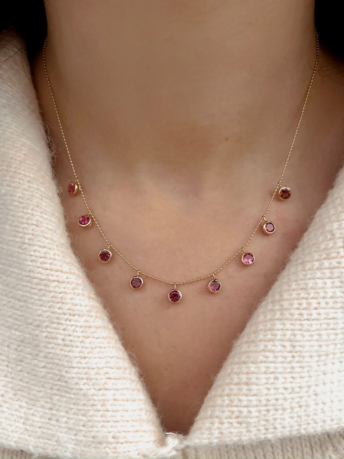 Handcrafted 18k Pink Tourmaline Station Necklace featuring nine pink tourmalines bezel set and dangling from a dainty ball chain necklace. Perfect as October Birthstone gift | Ella Creations Jewelry