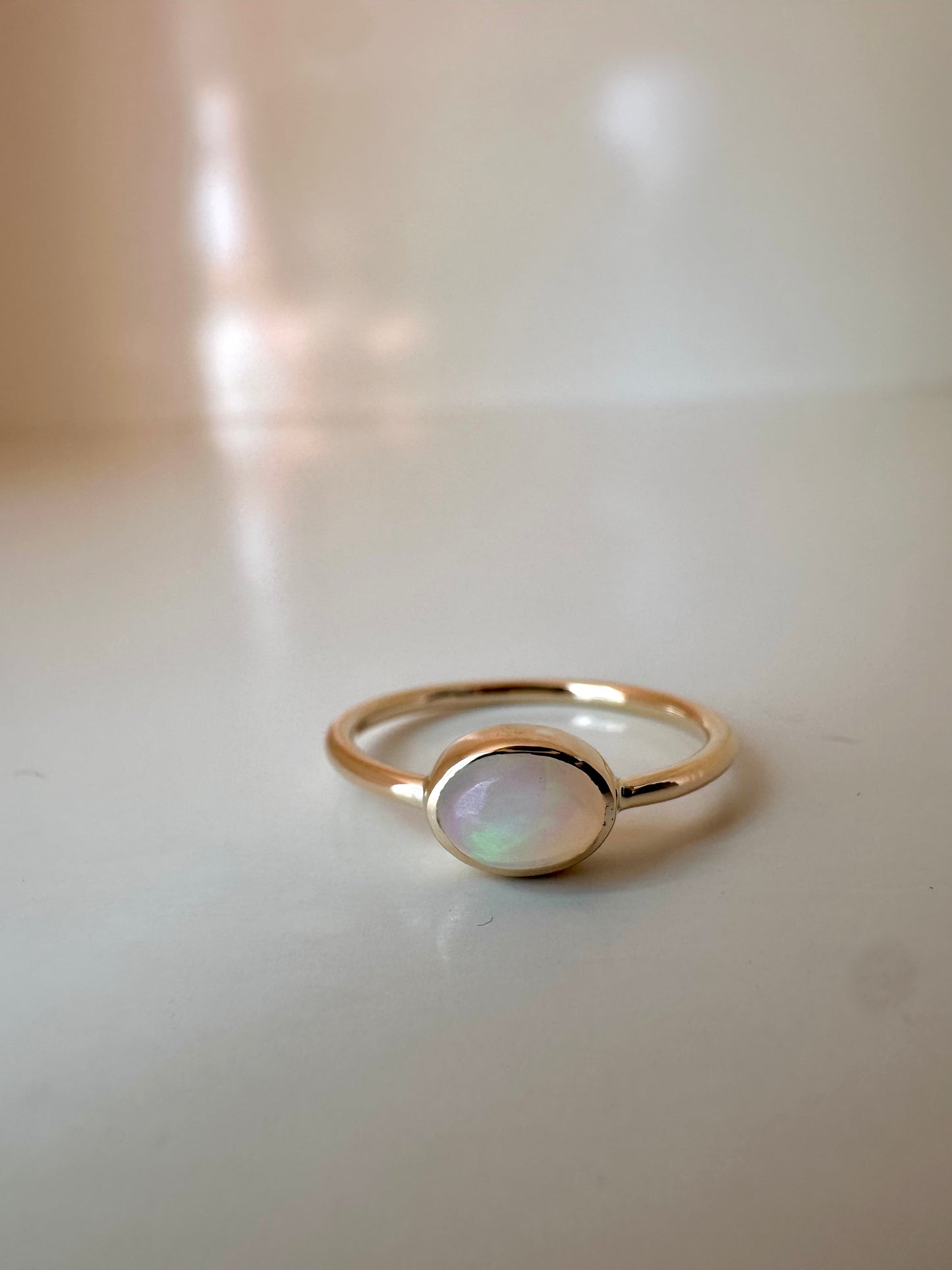 Opal gold ring, dainty with a thin band and a bezel set opal cabochon | Ella Creations Jewelry