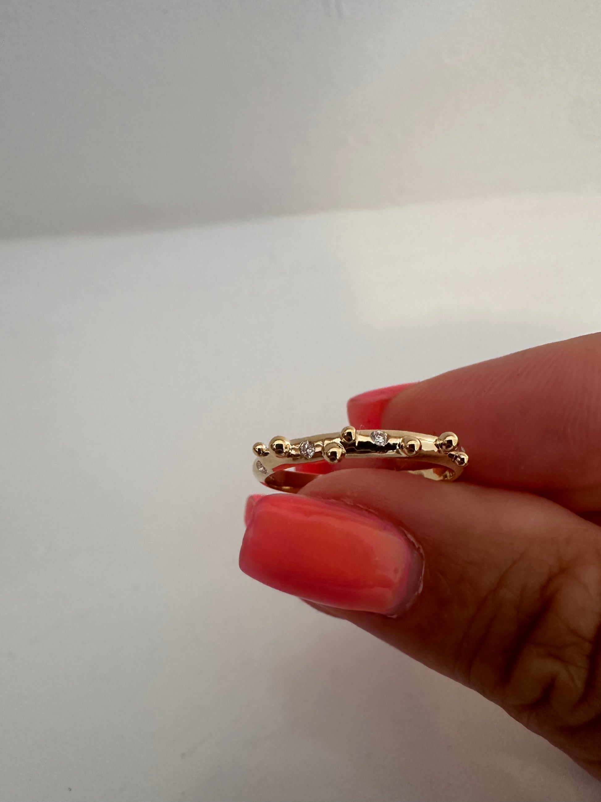 Elegant thin Diamond band, hand-crafted in 18k gold, this thin gold band features a smooth D shape band with gold granulations and 4 flushed diamonds of 1.4mm diameter each placed randomly between the granules. | Ella Creations jewelry
