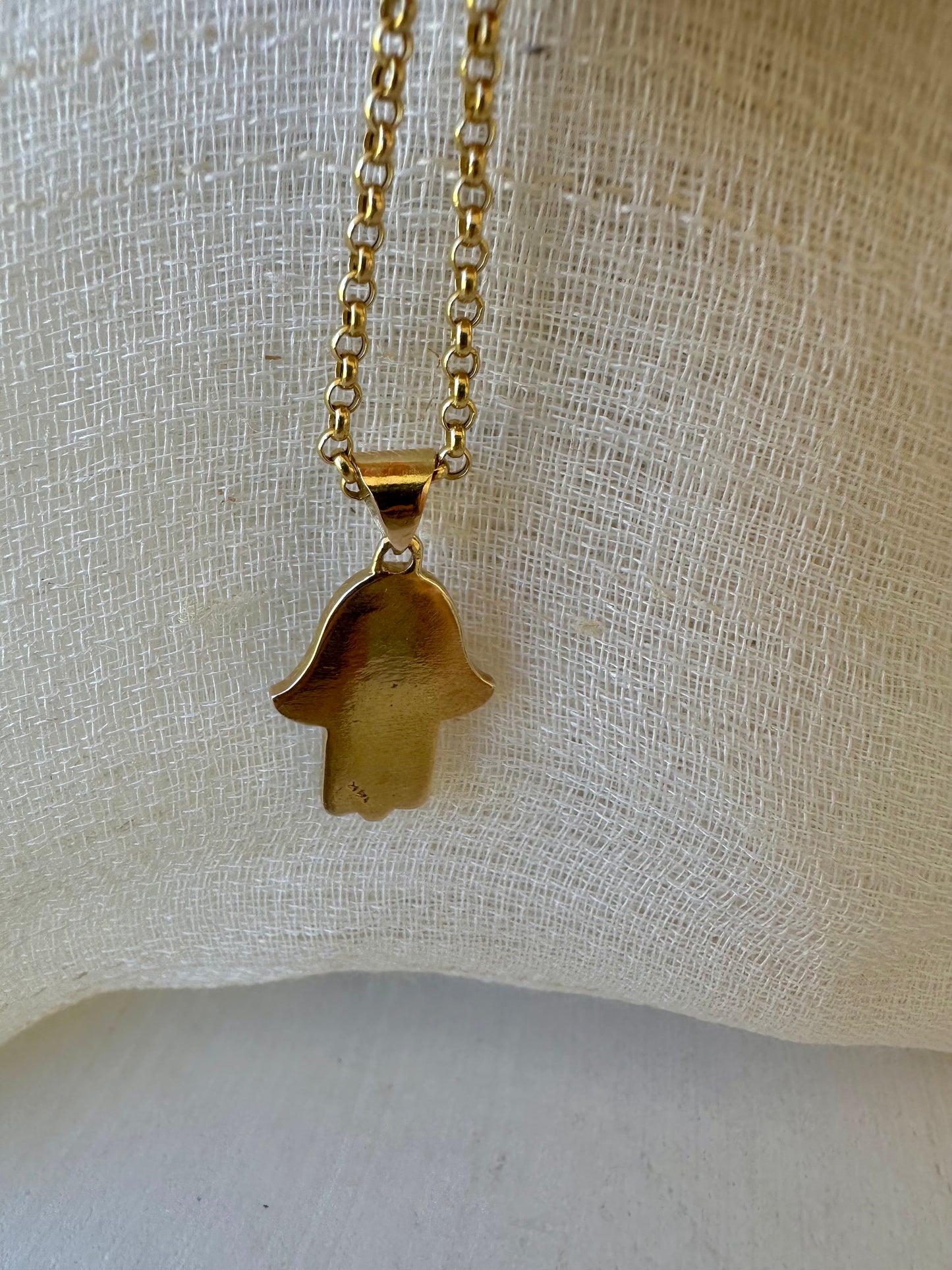 Stylish Gold Hamza Pendant adorned with aLapis Blue Stone at the center. Customizable in 14K or 18K
