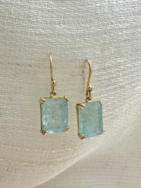 Elegant Drop Aquamarine Earrings handcrafted in 18 karat solid gold featuring emerald cut light green aquamarine stones in an open back prong setting and delicate french hooks. | Ella Creations Jewelry