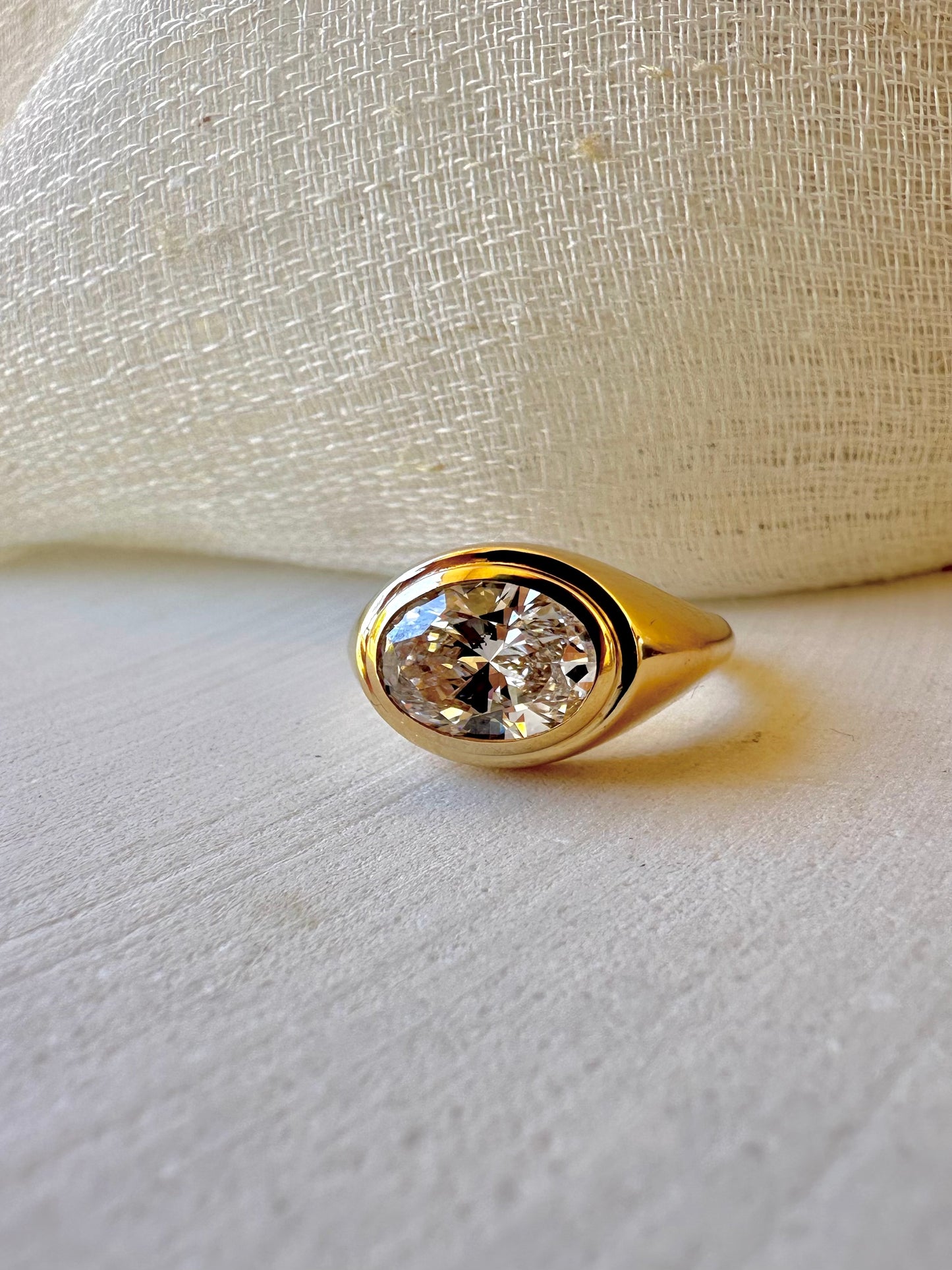 18K Oval Lab Diamond Ring, in a Signet Ring style featuring a bezel set 2ct Oval Lab Diamond | Ella Creations Jewelry