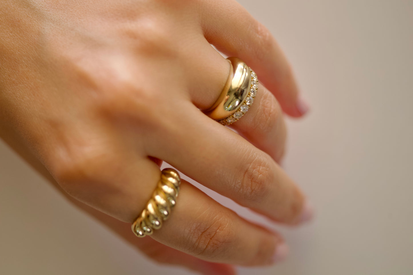 Gold croissant ring close-up, high polish twisted ridges