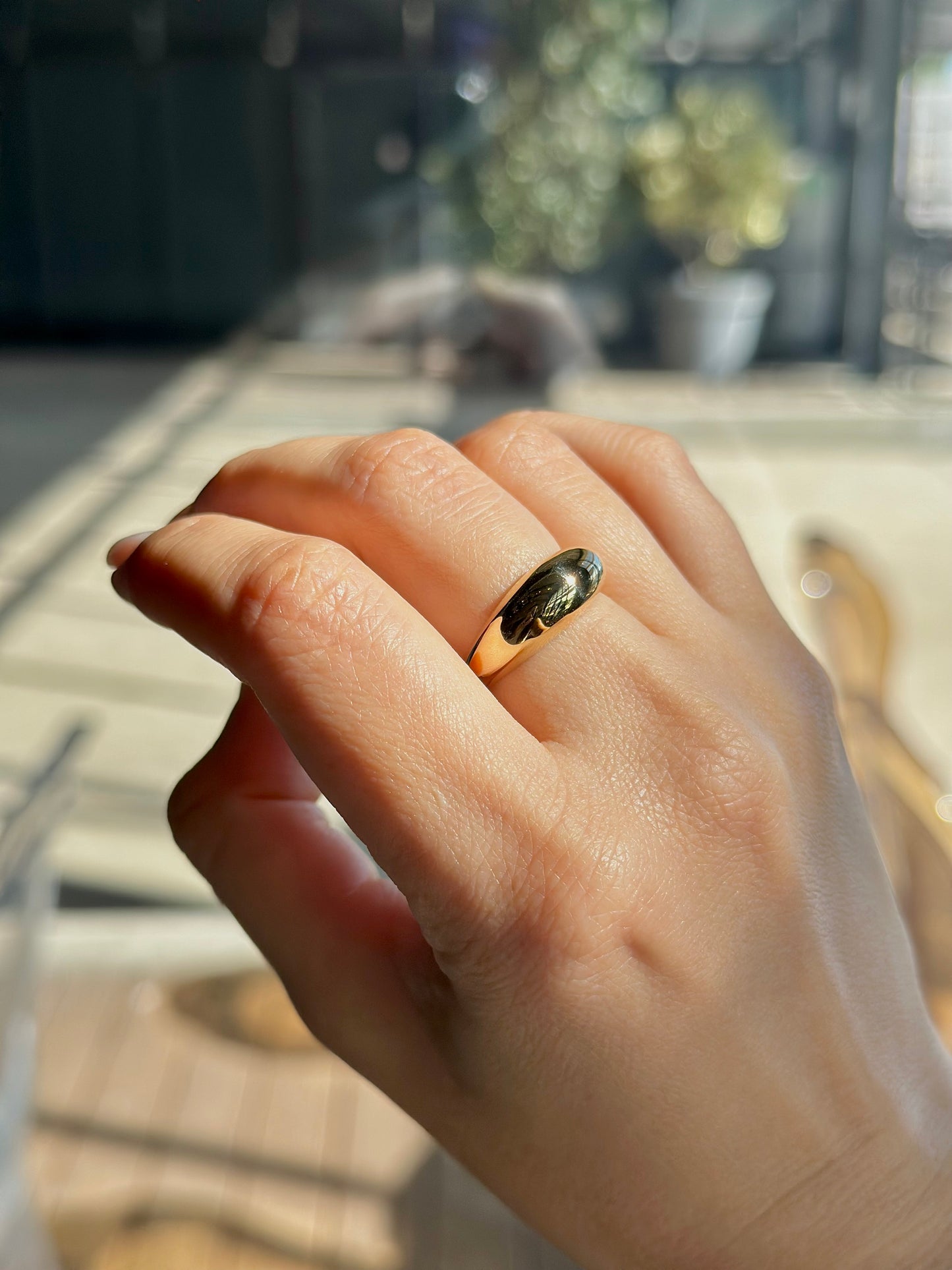 Gold Dome Ring handcrafted in 14k or 18k solid gold, the ring tampers from 7.5mm to 3mm | Ella Creations Jewelry 