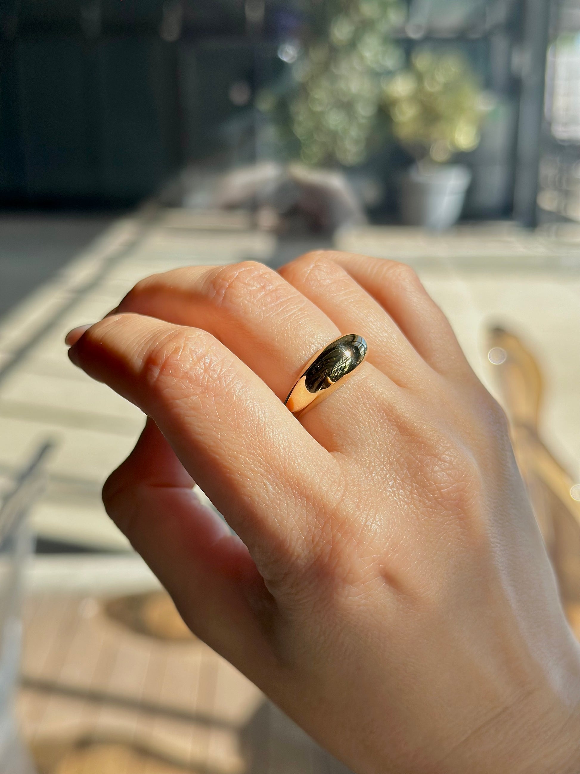 Gold Dome Ring handcrafted in 14k or 18k solid gold, the ring tampers from 7.5mm to 3mm | Ella Creations Jewelry 