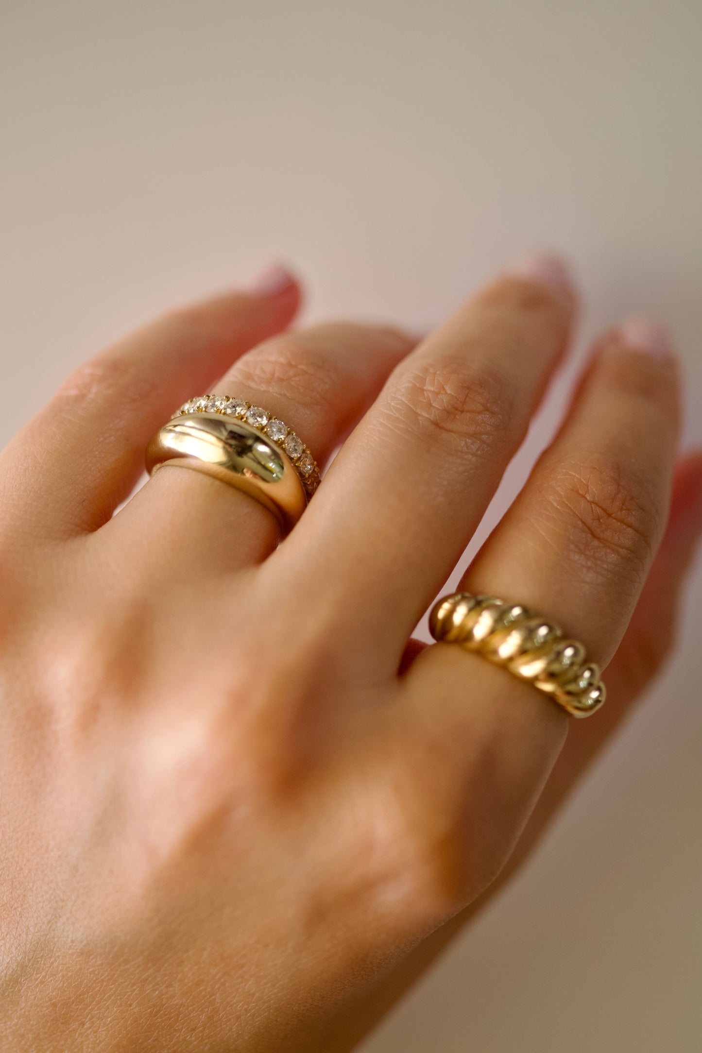 Twisted croissant ring worn in a gold ring stack | Ella Creations Jewelry 