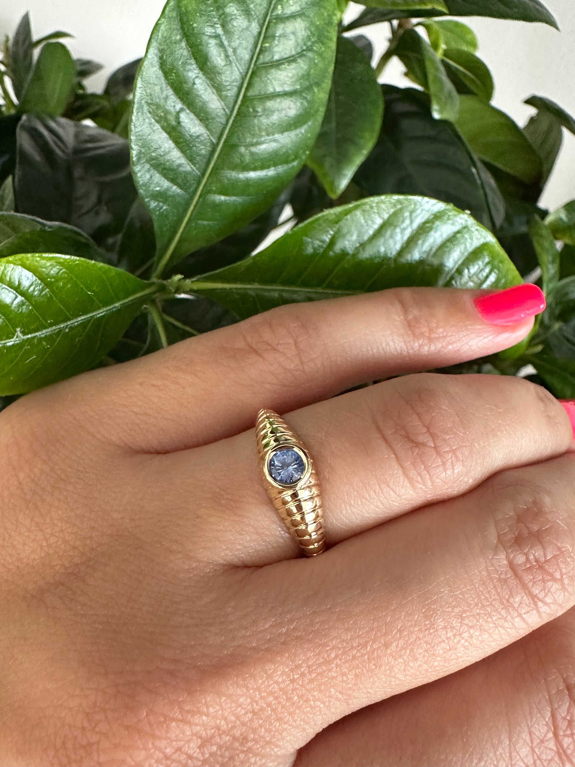 Gold Mina Sapphire Ring features a unique design that combines modern elements with a vintage-inspired aesthetic. It's a custom made ring showcasing a 4.3 mm bezel set Sapphire at its center | Ella Creations Jewelry