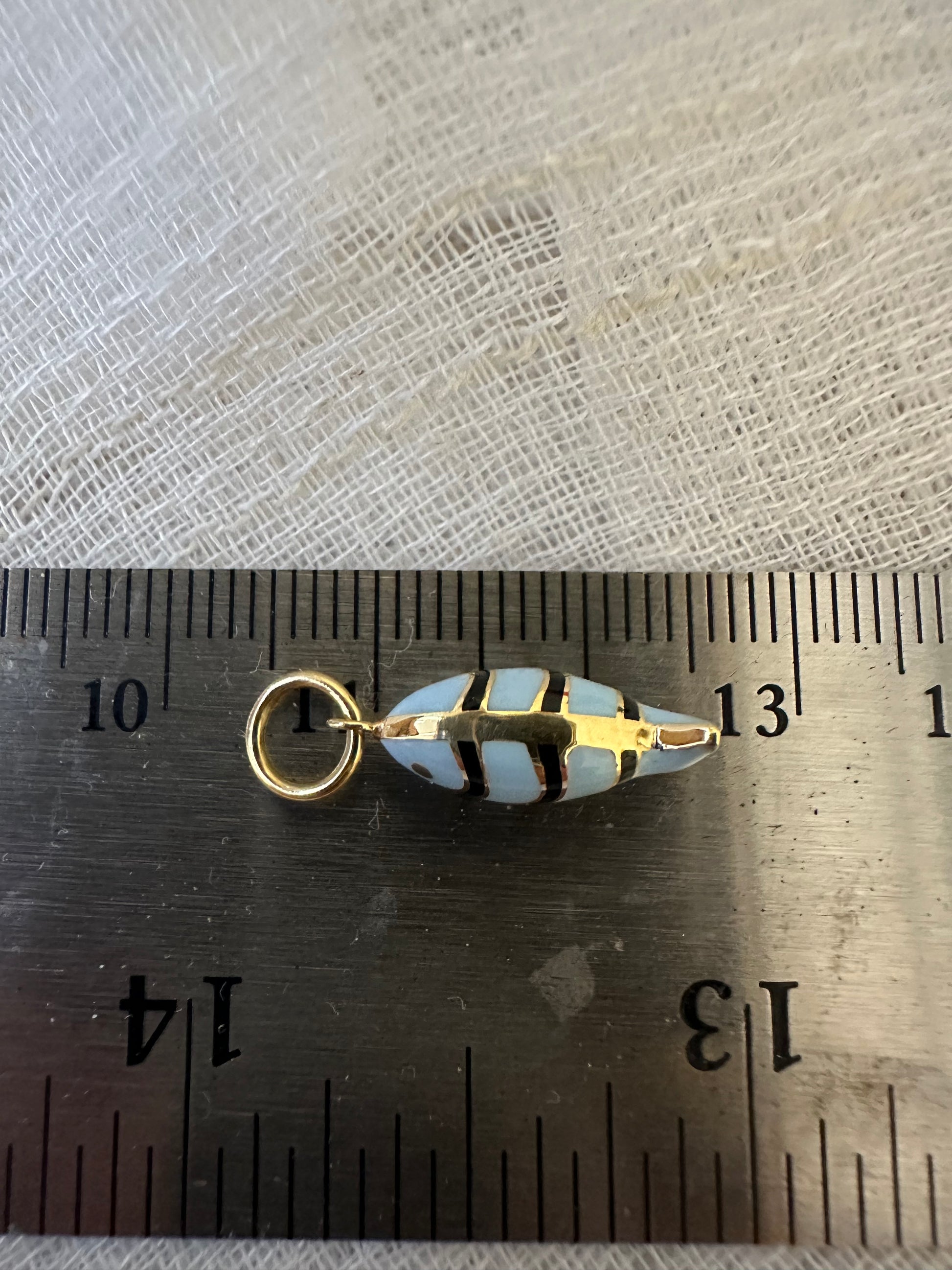 18k Gold Fish Charm, crafted in 18k yellow gold and beautifully accented with vibrant light blue and black enamel | Ella Creations Jewelry