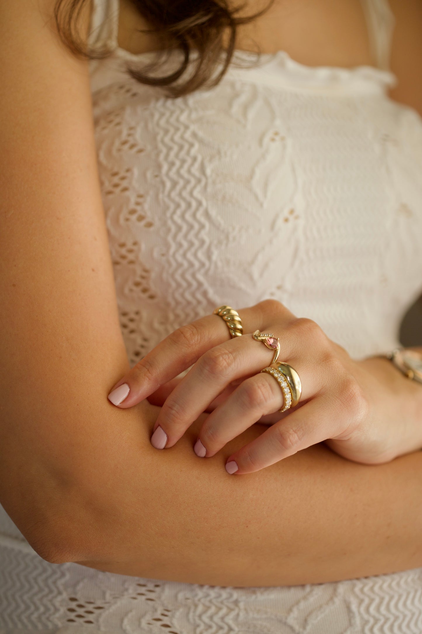 Twisted gold ring in solid 14k gold on hand