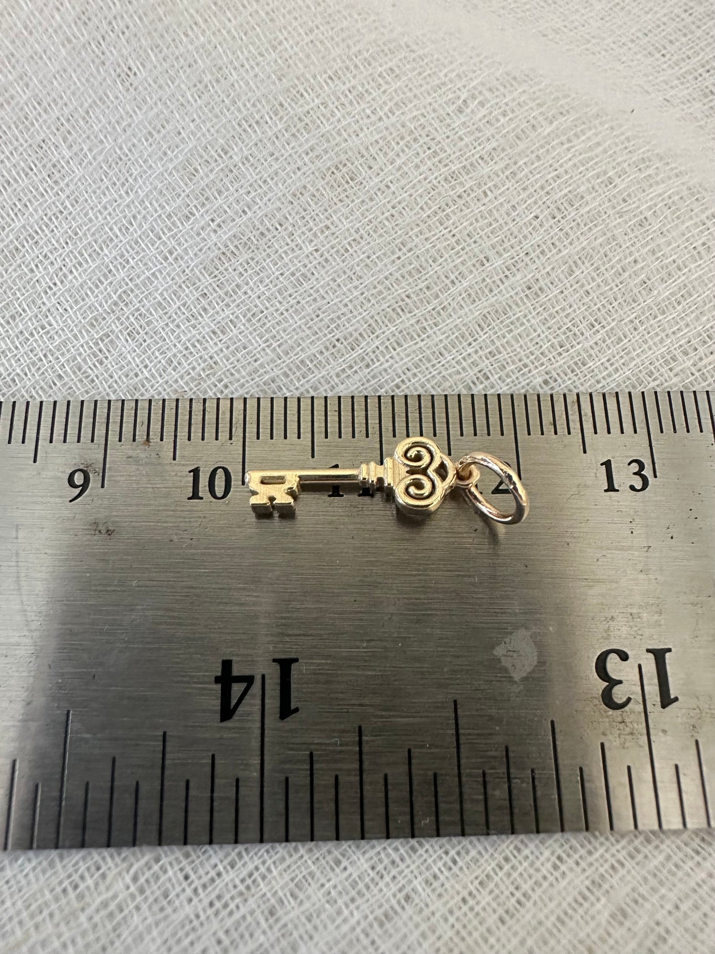 Gold Key charm inspired by the Palestinian Nakba and the hope to return, available in 14K and 18K 