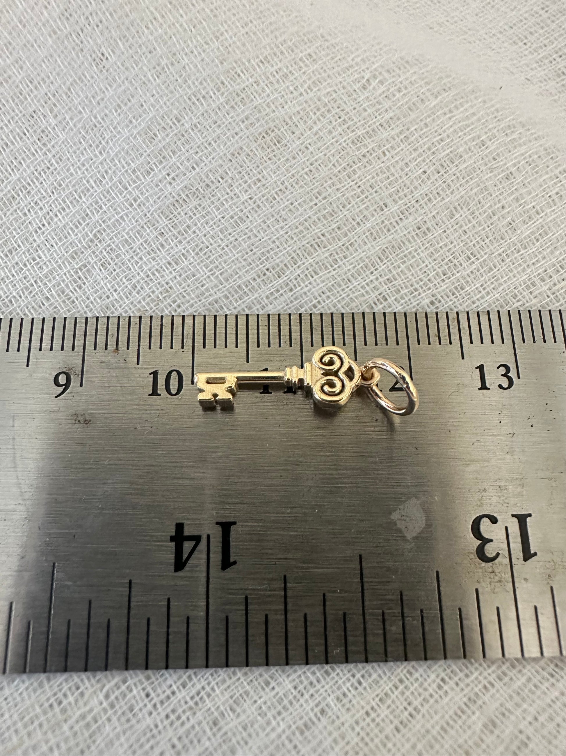 Gold Key charm inspired by the Palestinian Nakba and the hope to return, available in 14K and 18K 