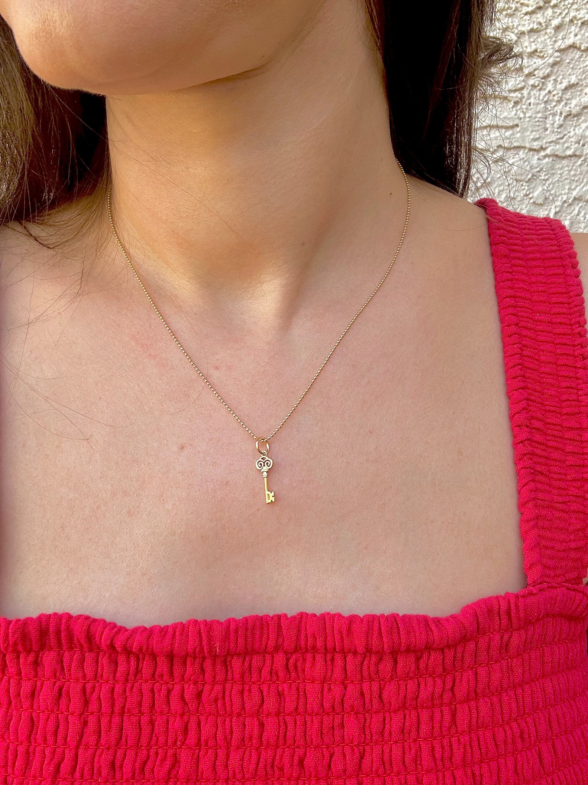 Gold Key charm inspired by the Palestinian Nakba and the hope to return, available in 14K and 18K 