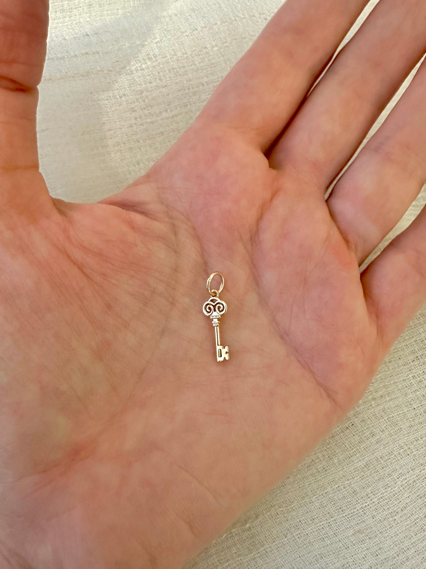 Gold Key charm inspired by the Palestinian Nakba and the hope to return, available in 14K and 18K 