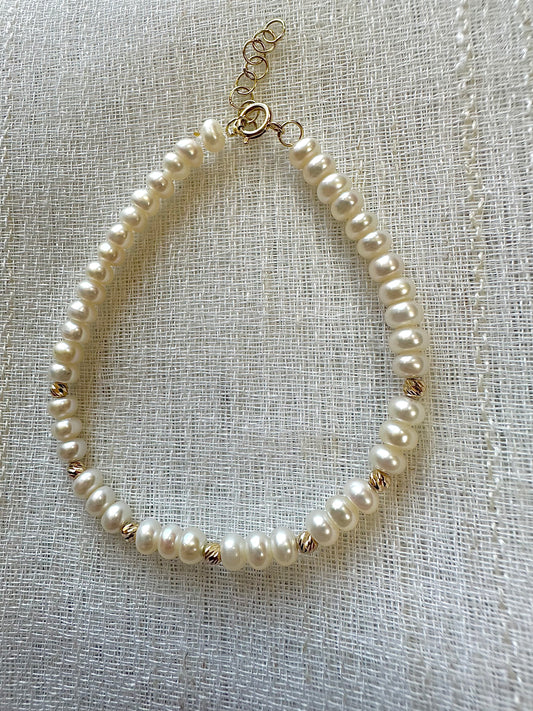 Freshwater Pearls Beaded bracelet featuring 18 karat faceted beads and findings.&nbsp; Available with a chain extender for a comfort wear. | Ella Creations Jewelry