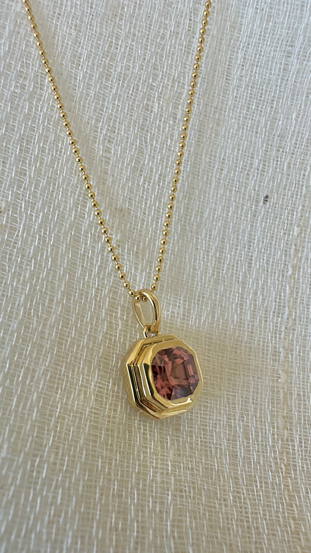 Pink Zircon pendant, set into a custom, two-tiered 18k gold bezel that matches the stone's hexagon shape. | Ella creations Jewelry