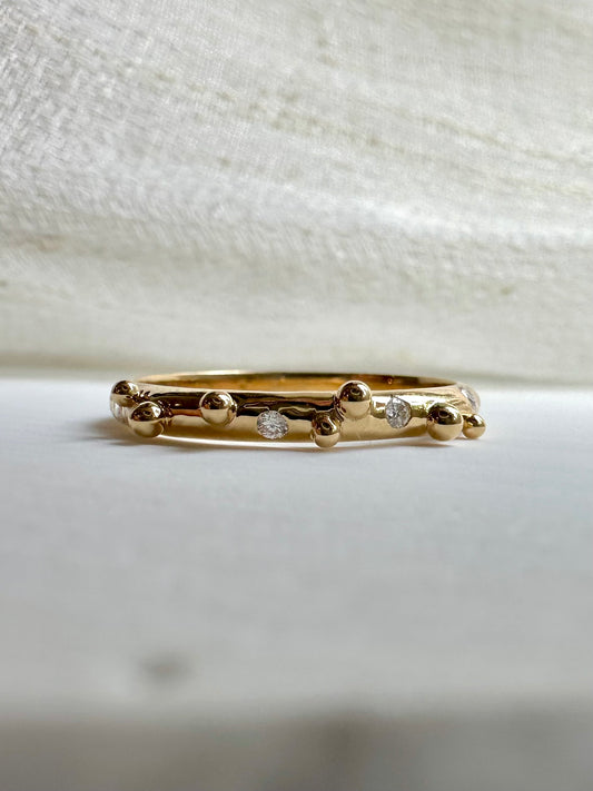 Elegant thin Diamond band, hand-crafted in 18k gold, this thin gold band features a smooth D shape band with gold granulations and 4 flushed diamonds of 1.4mm diameter each placed randomly between the granules | Ella Creations jewelry