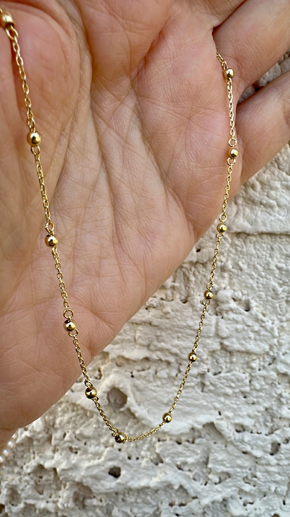 Delicate ball chain handcrafted in 18 karat gold featuring 2.5mm gold beads individually and manually wrapped onto the chain | Ella Creations Jewelry