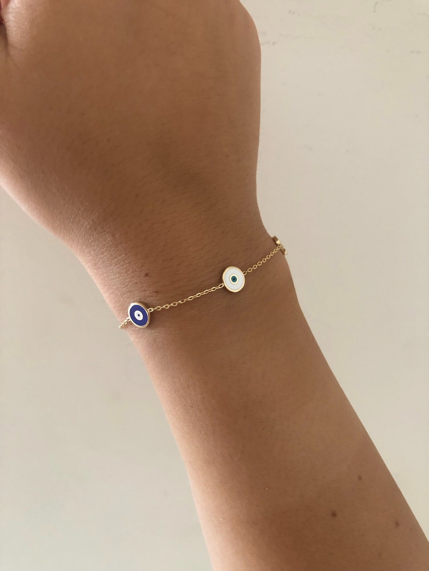 charm bracelet with evil eye round charms gold | Ella Creations Jewelry 