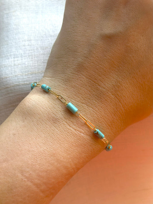 18k Paperclip Bracelet adorned with 7 Turquoise tube beads, perfect for day-to-day styling and stacking with other bracelets. | Ella Creations Jewelry