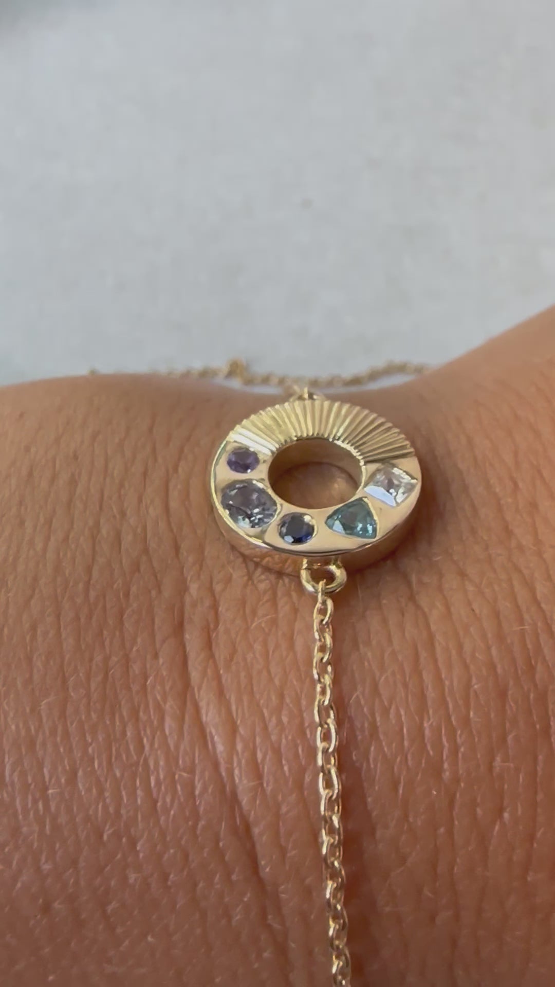 Exquisite Gemstone Bracelet, featuring multiple gemstones at one side: Sapphire, Spinel &amp; Zircon, and a ribbed pattern on the other side. Crafted in 18k gold with meticulous attention to detail, this bracelet is a testament to fine craftsmanship and artistic vision.