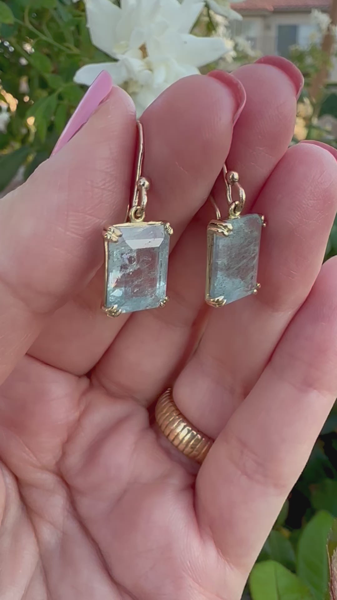Elegant Drop Aquamarine Earrings handcrafted in 18 karat solid gold featuring emerald cut light green aquamarine stones in an open back prong setting and delicate french hooks. | Ella Creations Jewelry