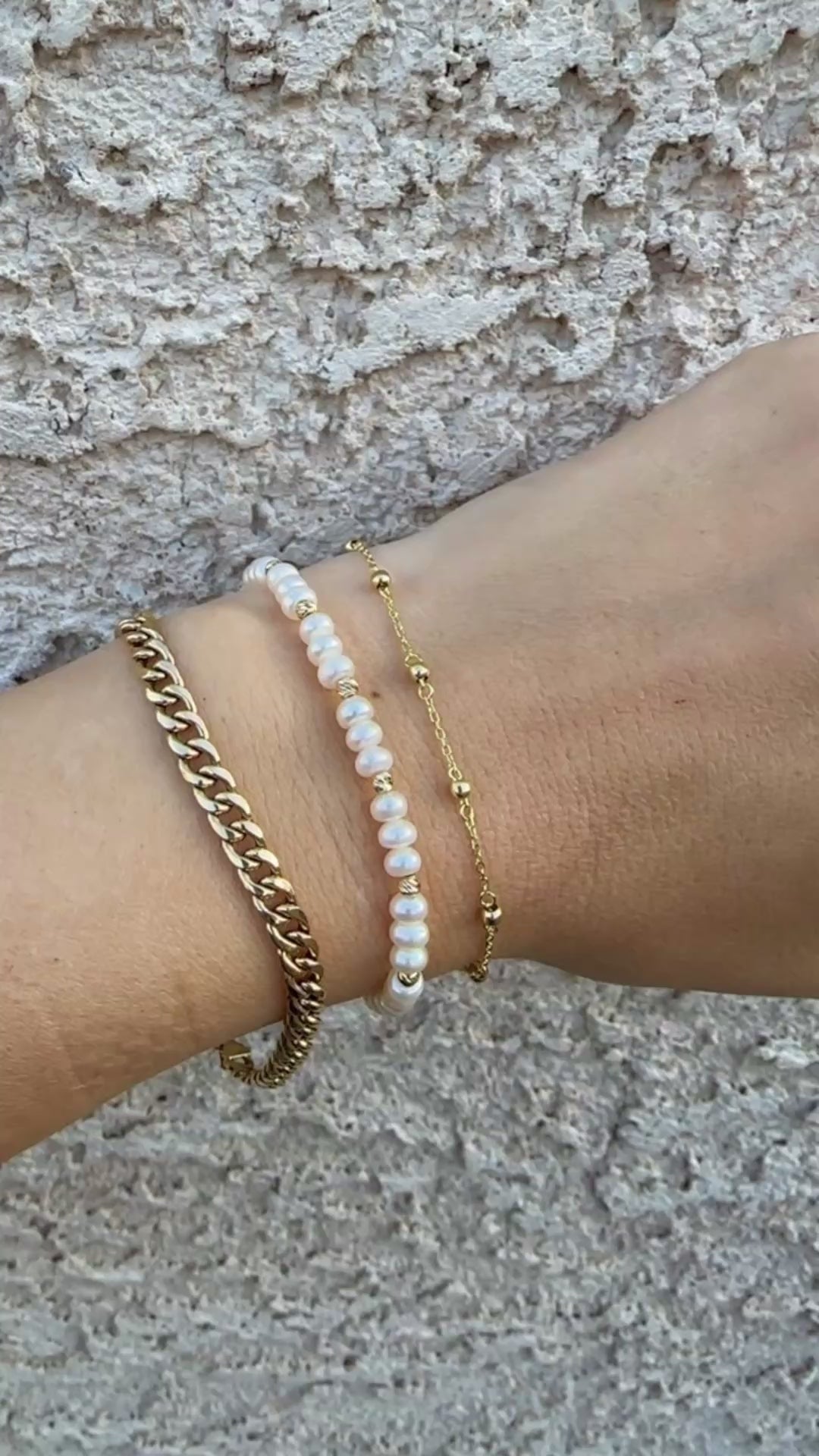Gold Ball Bracelet featuring gold beads strung seamlessly on a delicate chain.

This Simple Gold bracelet is perfect for a minimalistic stand alone look or for stacking with other bracelets.